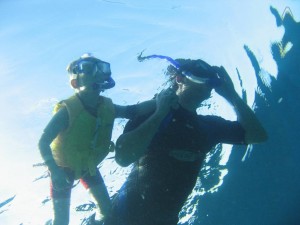 Father and kid snorkeling